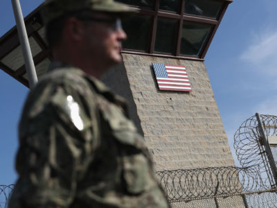 A US Naval officer stands at the entrance of the US prison at Guantanamo Bay, Cuba, on October 22, 2016.