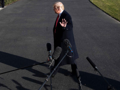 President Trump walks past the media as he arrives at the White House in Washington, DC, on January 6, 2019, as the government shutdown enters its third week.