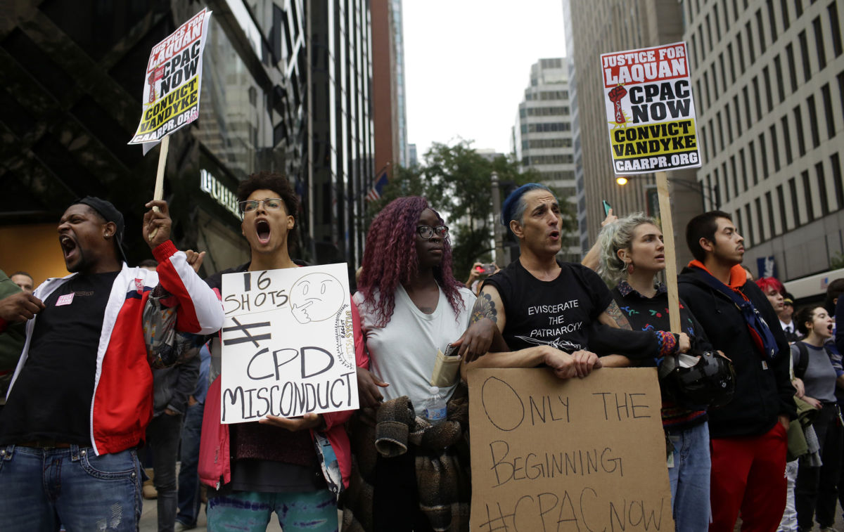 Demonstrators march after hearing the verdict in the murder trial of Chicago police officer Jason Van Dyke along Michigan Avenue on October 5, 2018, in Chicago, Illinois. Van Dyke was found guilty of second-degree murder and 16 counts of aggravated battery in the shooting death of 17-year-old Laquan McDonald on October 20, 2014.