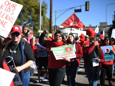 Striking public school teachers and their supporters march during the 34th annual Kingdom Day Parade on Martin Luther King Day, January 21, 2019, in Los Angeles, California.