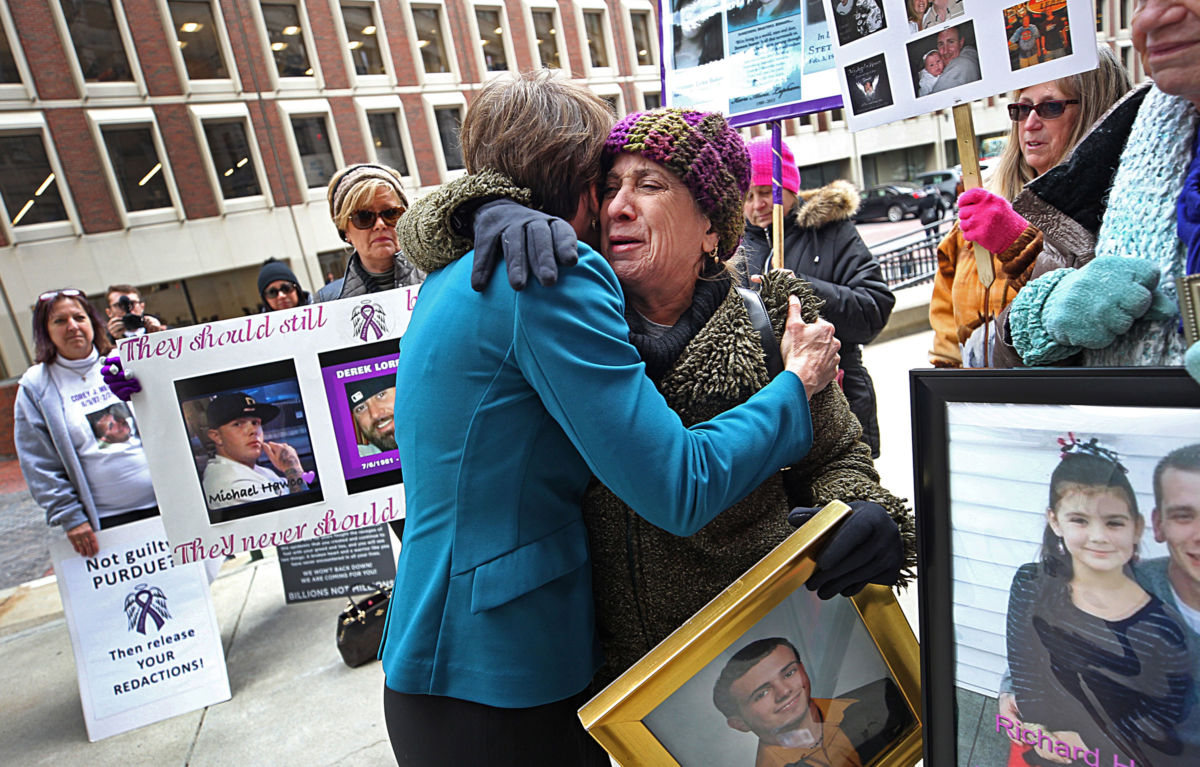 Attorney General Maura Healey hugs Paula Haddad, whose son Jordan died from opioids at the age of 26, as Healey entered the Suffolk Superior Court in Boston for a status update on the attorney general's suit against Purdue Pharma on January 25, 2019.