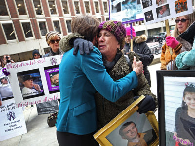 Attorney General Maura Healey hugs Paula Haddad, whose son Jordan died from opioids at the age of 26, as Healey entered the Suffolk Superior Court in Boston for a status update on the attorney general's suit against Purdue Pharma on January 25, 2019.