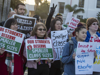 Teachers, retired teachers and parents show their support for the United Teachers of Los Angeles in front of Venice High School in Venice, California, on January 10, 2019.