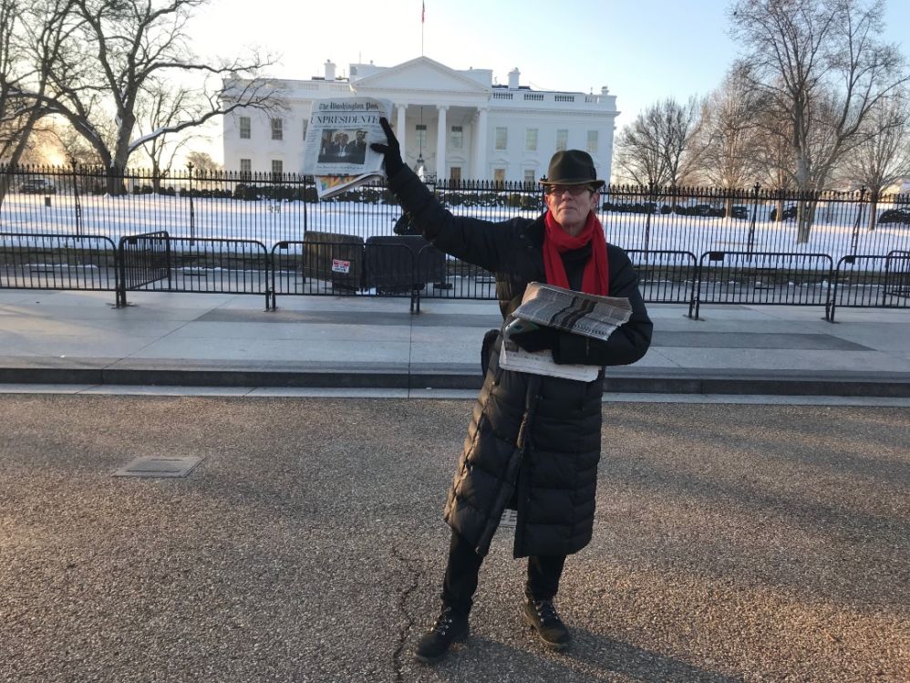 L.A. Kauffman hands out copies of the unauthorized Washington Post outside the White House.
