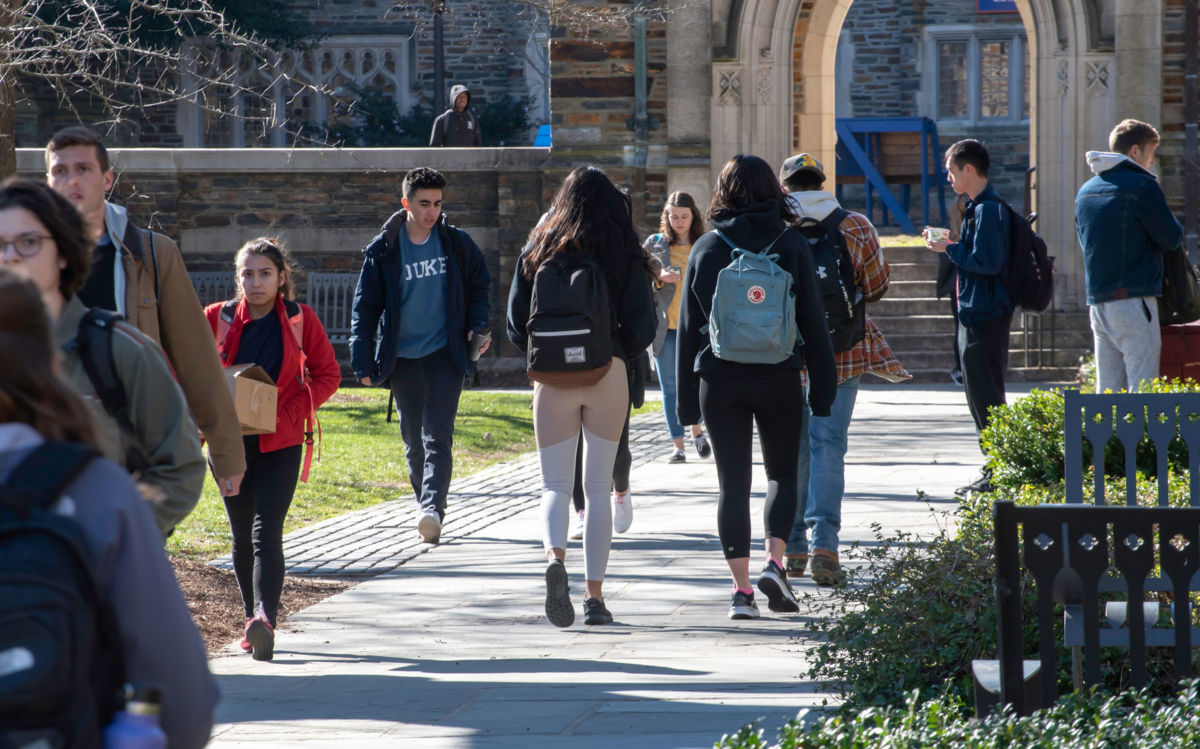 College students walk across campus at Duke University. A department chair's email scolding students for speaking their native language provoked a wave of criticism at the university.