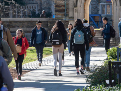 College students walk across campus at Duke University. A department chair's email scolding students for speaking their native language provoked a wave of criticism at the university.