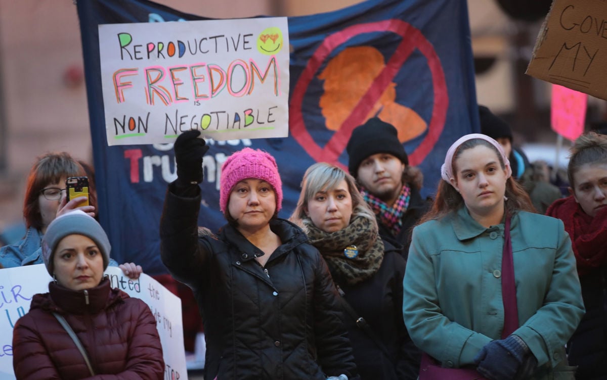 Demonstrators protest in front of the Thompson Center to voice their support for Planned Parenthood and reproductive rights on February 10, 2017, in Chicago, Illinois. Illinois Democrats' pro-choice push could help providers cope with an influx of out-of-state patients.