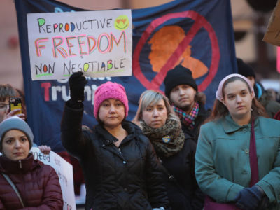 Demonstrators protest in front of the Thompson Center to voice their support for Planned Parenthood and reproductive rights on February 10, 2017, in Chicago, Illinois. Illinois Democrats' pro-choice push could help providers cope with an influx of out-of-state patients.