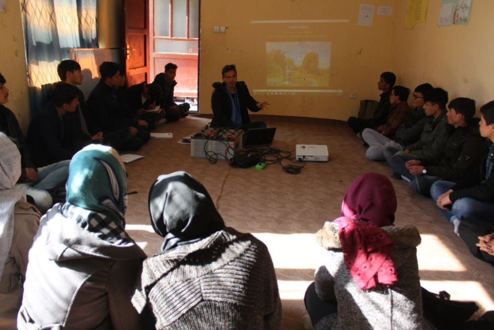 Muhammad Ali teaching a "relational learning circle" class during orientation at the APV Borderfree Center.