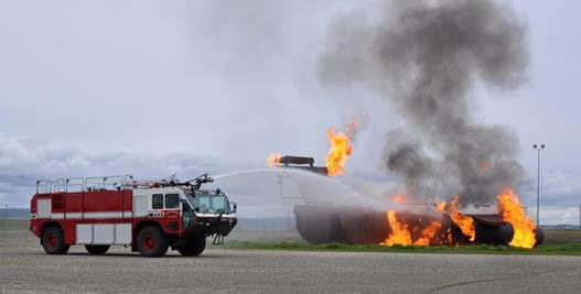 A Beale fire truck sprays down a simulated aircraft fire.