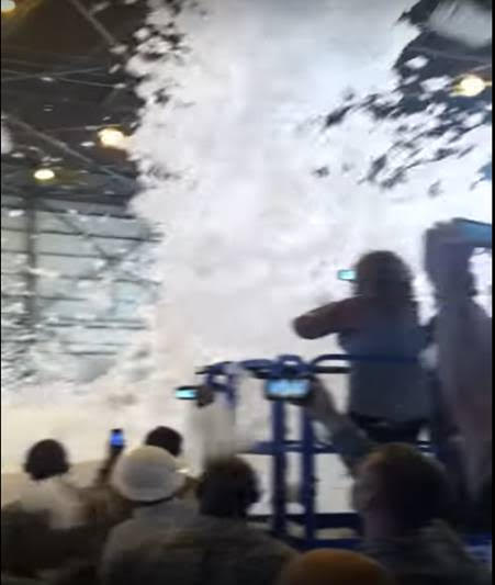 The AFFF system is tested in a celebratory fashion at Travis AFB, California. Potentially cancerous foam falls like snowflakes among the crowd.