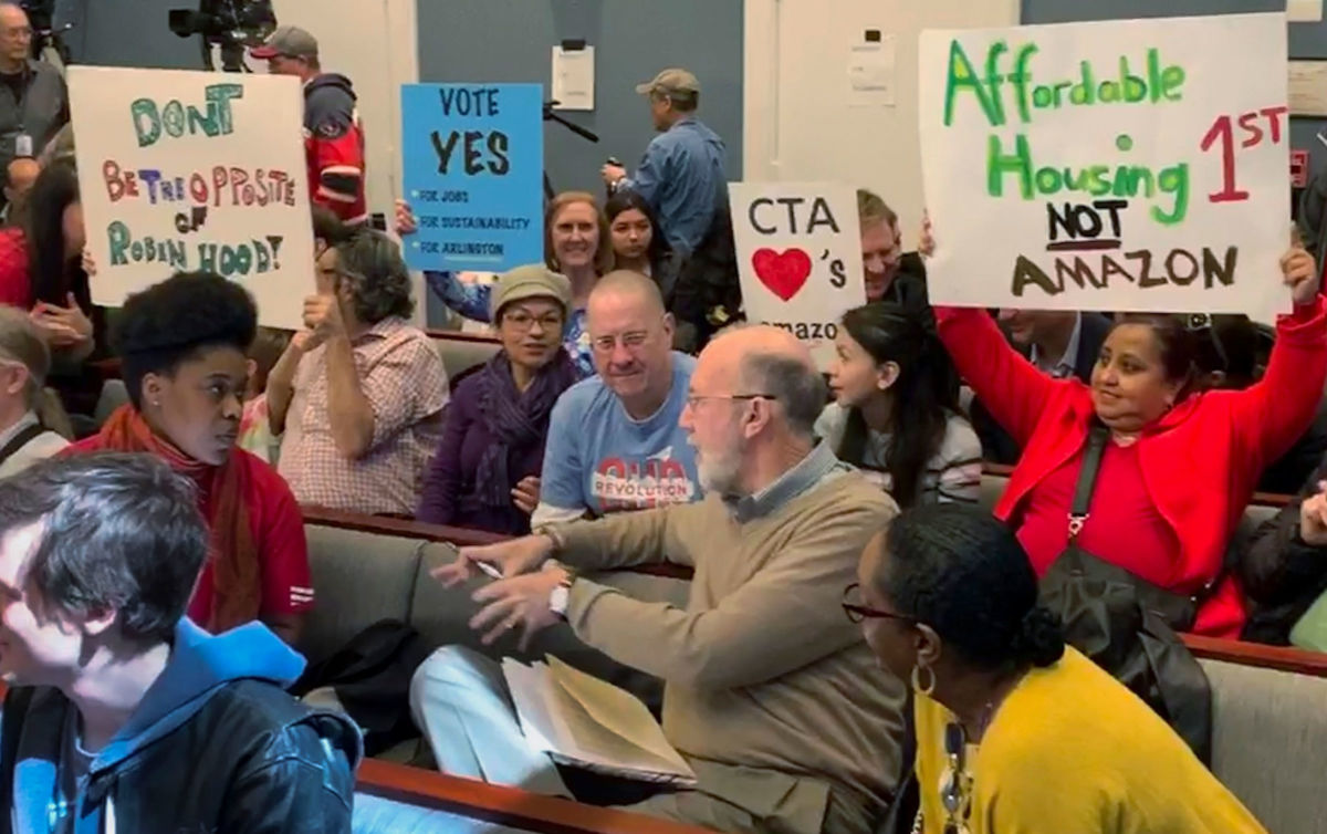 People for and against Amazon crowd into the Arlington County Board room for a meeting where more than 100 people spoke on March 16, 2019.