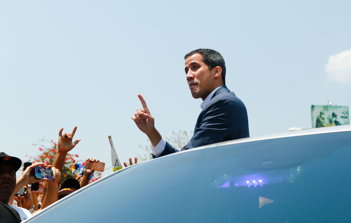 Opposition leader and self proclaimed Interim President of Venezuela Juan Guaidó waves to supporters during a Citizens' Assembly on March 16, 2019, in Valencia, Venezuela.