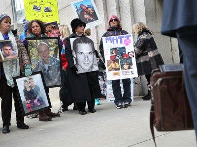 Families who have lost loved ones to the opioid crisis protest at Suffolk Superior Court﻿