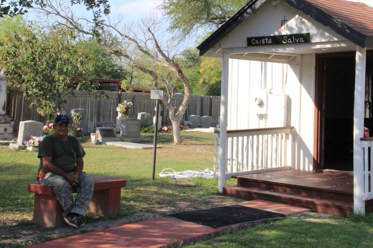 Cesar Ortiz, who helps maintain the Jackson Ranch Chapel and Cemetery, sits just outside the chapel on March 1, 2019, in San Juan, Texas.
