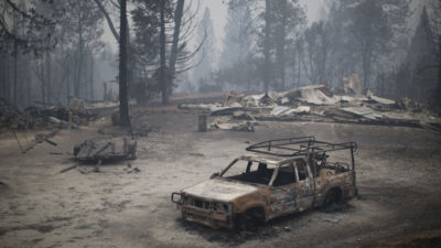 A burned truck and structures are seen in the wake of the Butte Fire, which burned over 70,000 acres, on September 13, 2015, near San Andreas, California.