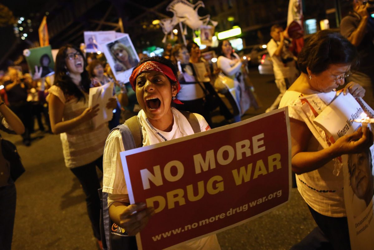 Protesters hold a candlelight vigil and a march calling for the end of the drug war on September 6, 2012, in New York City. The influence of the drug war has reshaped U.S. society.