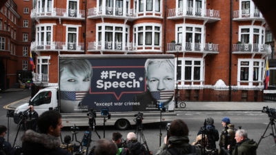 A van bearing a message in support of Chelsea Manning and Julian Assange sits outside an apartment complex