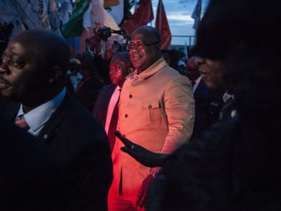 Felix Tshisekedi is let from below with red light while flanked by guards