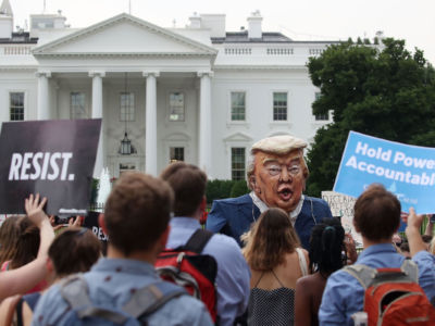 People protest against President Trump in front of the White House on July 11, 2017, in Washington, D.C.
