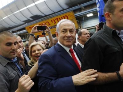 Israeli Prime Minister Benjamin Netanyahu walks with his wife Sara through the Machane Yehuda market in Jerusalem on April 8, 2019.