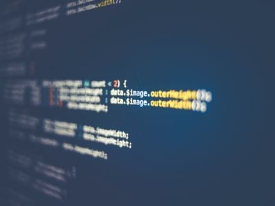 HTML coding against a black computer screen