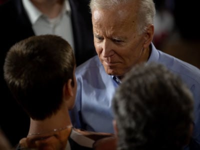 Joe Biden interacts with a young boy during a rally