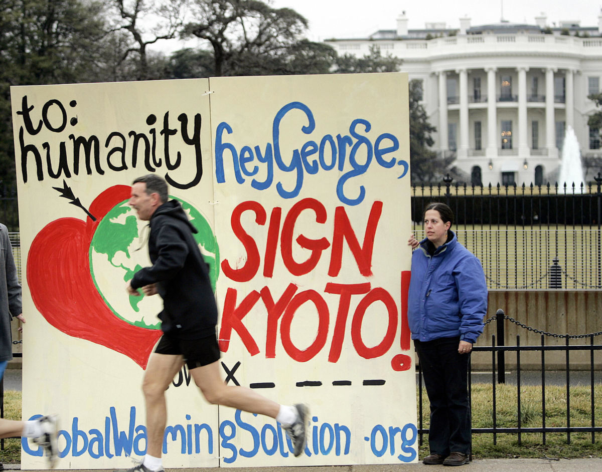 An activist protests President George W. Bush's withdrawal of support for the Kyoto Protocol near the White House. The U.S. had withdrawn from the treaty citing a lack of scientific evidence on global warming. New documents reveal the U.S. State Department gave the Global Climate Coalition credit for leading Bush to reject the landmark treaty in 2001.