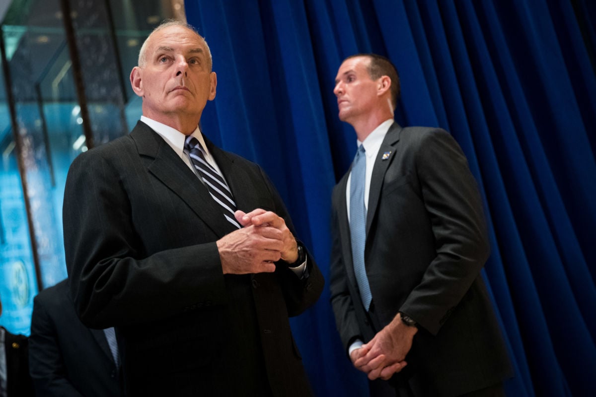 Former White House Chief of Staff Gen. John Kelly looks on as President Donald Trump speaks following a meeting on infrastructure at Trump Tower, August 15, 2017, in New York City.