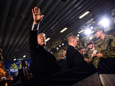 President Donald Trump and First Lady Melania Trump greet Marines aboard the amphibious assault ship USS Wasp during a Memorial Day event in Yokosuka on May 28, 2019.