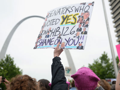 A demonstrator displays a sign during a protest over restrictive abortion laws in St Louis, Missouri.
