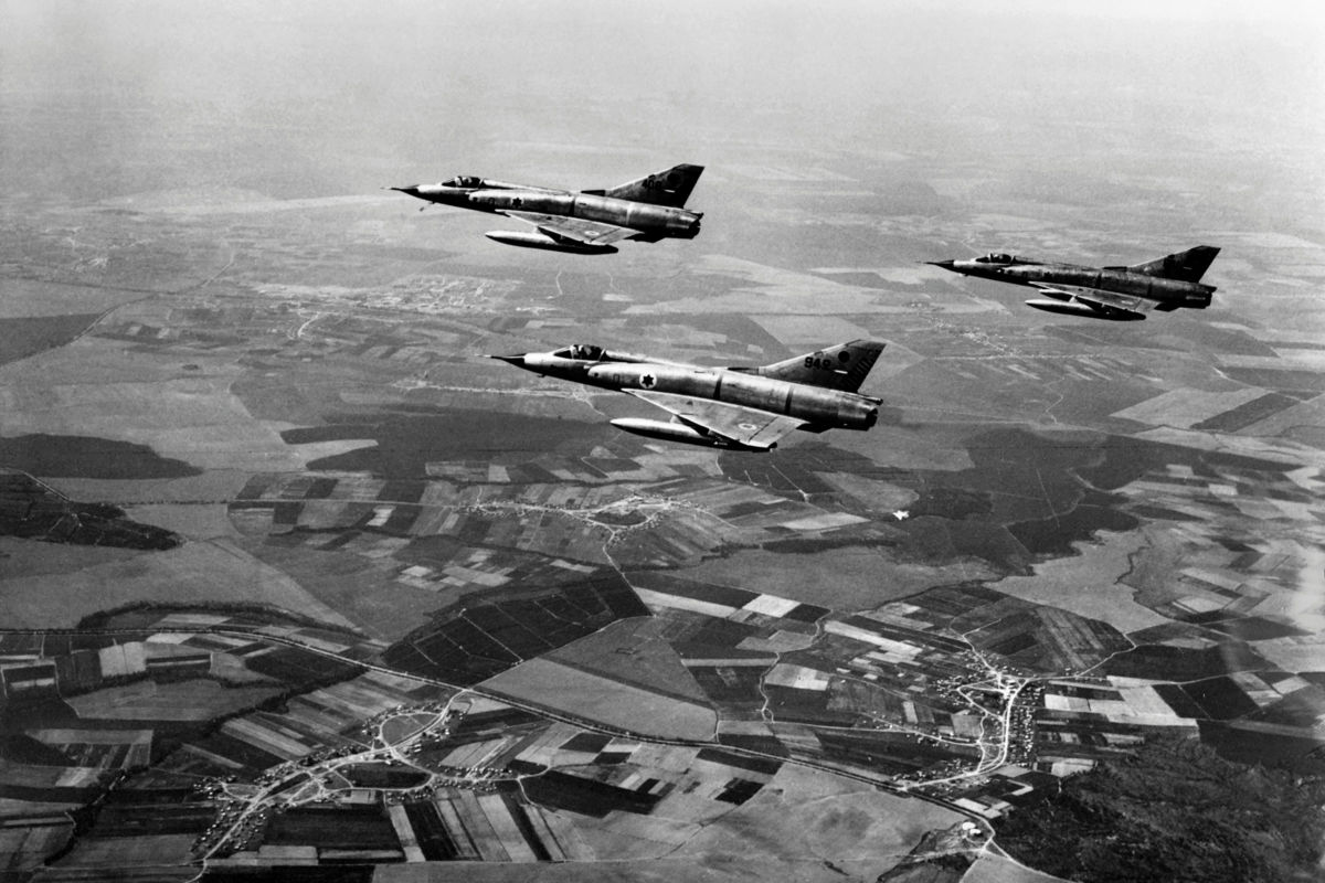 "Mirages" of the Israeli army fly over the Sinai at the Israeli-Egyptian border on June 5, 1967, on the first day of the Six-Day War between Israel and Egypt. On June 5, Israel launched preemptive attacks against Egypt and Syria.