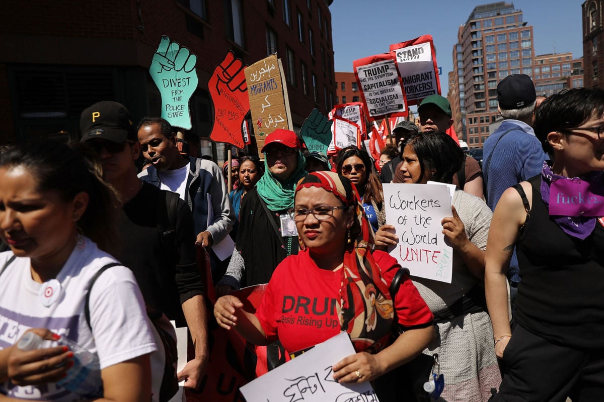 People march in May Day protests on May 1, 2018, in New York City.