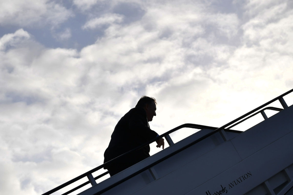 Secretary of State Mike Pompeo boards a plane before departing from London Stansted Airport, north of London, on May 9, 2019.