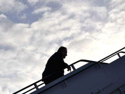 Secretary of State Mike Pompeo boards a plane before departing from London Stansted Airport, north of London, on May 9, 2019.