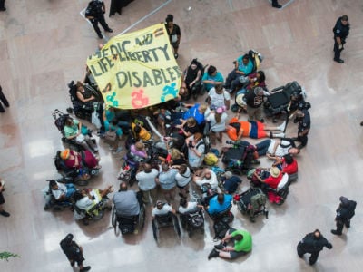 Demonstrators gather in the atrium of Hart Building to protest the Senate's health care bill on July 25, 2017.