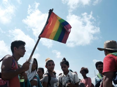 Members of an LGBT group traveling with the the Central American migrant caravan wait for a ride on November 1, 2018, in Juchitan de Zaragoza, Mexico.