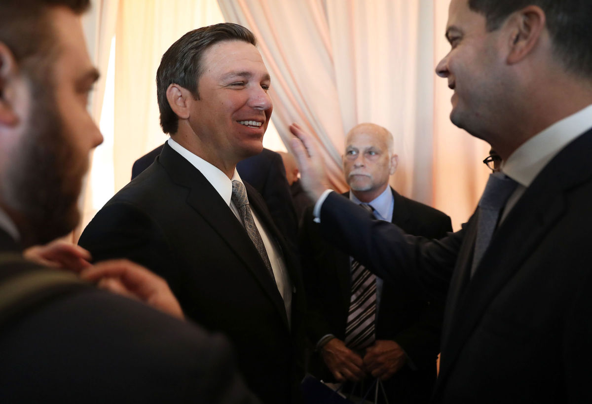 Gov. Ron DeSantis greets people as he attends an event at the Freedom Tower on January 9, 2019, in Miami, Florida.