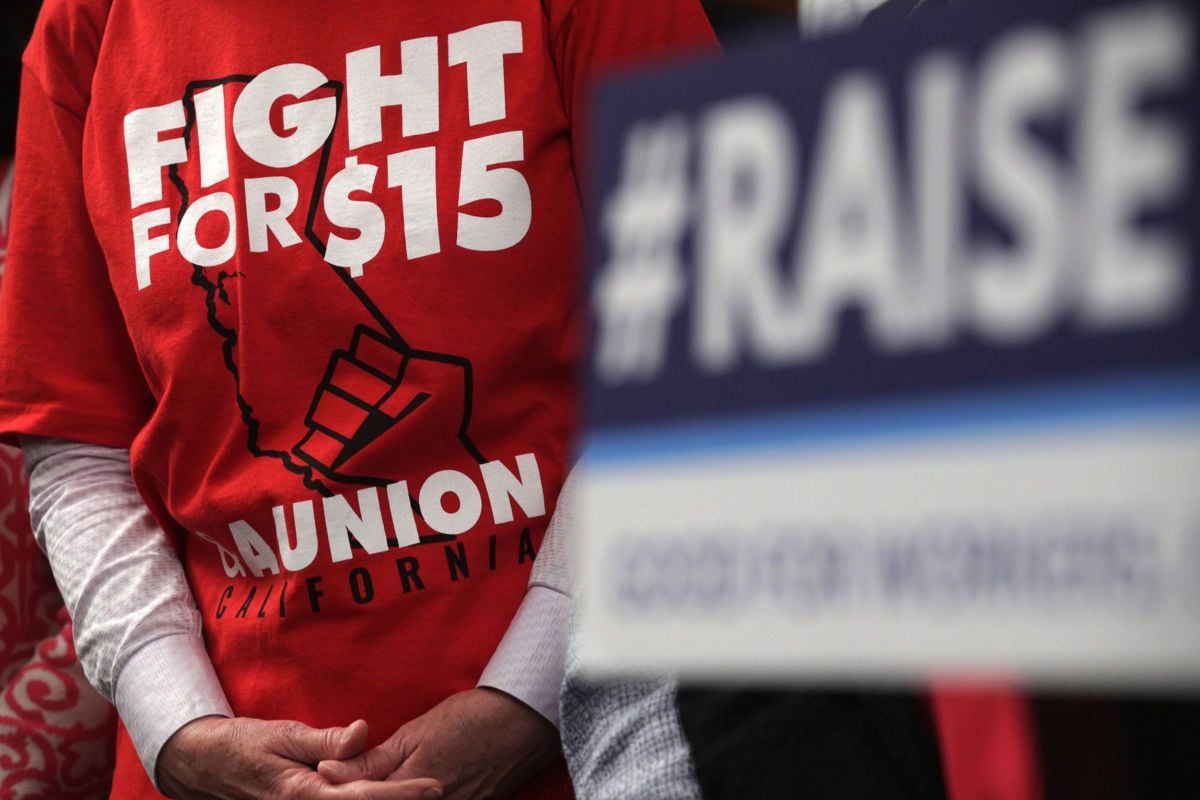An activist wears a "Fight For $15" T-shirt during a news conference prior to a vote on the Raise the Wage Act July 18, 2019, at the U.S. Capitol in Washington, D.C.
