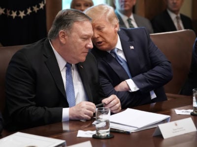 President Trump talks with Secretary of State Mike Pompeo during a cabinet meeting at the White House, July 16, 2019, in Washington, D.C.