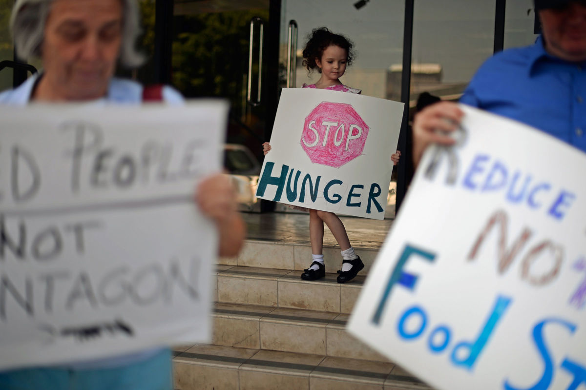 Demonstrators protest cuts to food stamps in Los Angeles, California, June 17, 2013.