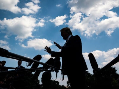 President Trump stops to talk to reporters and members of the media as he walks from the Oval Office to board Marine One on July 19, 2019, in Washington, D.C.