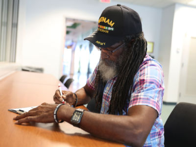 Clarence Singleton registers to vote at the Lee County Supervisor of Elections office on January 8, 2019, in Fort Myers, Florida. Mr. Singleton was able to register to vote for the first time after his right to vote was taken away in 2008 as a new constitutional amendment took effect.
