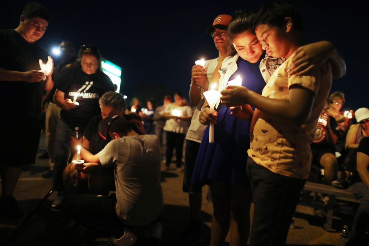 People attend a candlelight prayer vigil outside Immanuel Baptist Church, located near the scene of a mass shooting which left at least 22 people dead, on August 5, 2019, in El Paso, Texas.