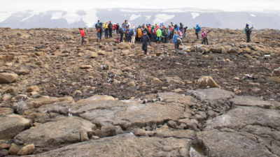 People attend a monument unveiling at the site of Okjökull, Iceland's first glacier lost to climate change, in the west of Iceland on August 18, 2019.