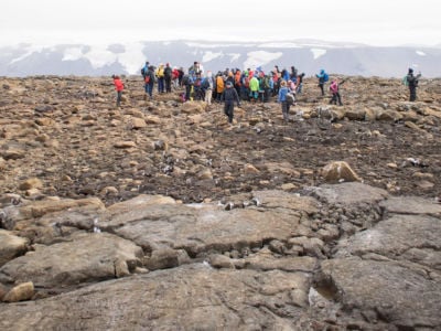 People attend a monument unveiling at the site of Okjökull, Iceland's first glacier lost to climate change, in the west of Iceland on August 18, 2019.
