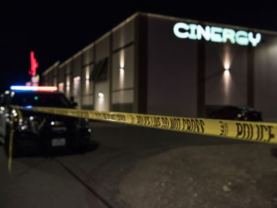 Police cars and tape block off a crime scene outside the Cinergy Odessa movie theater where a gunman was shot and killed on August 31, 2019, in Odessa, Texas.