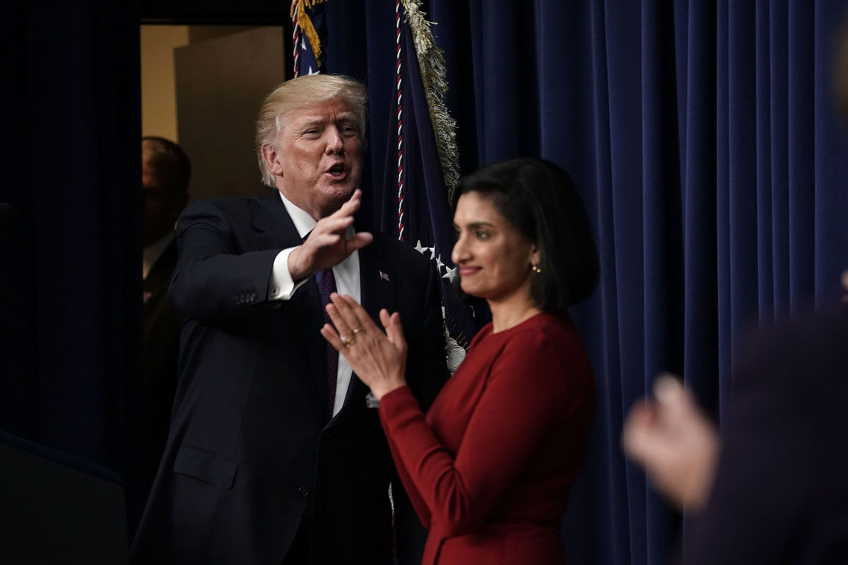 President Trump acknowledges the audience as Administrator of the Centers for Medicare and Medicaid Services Seema Verma looks on at the Eisenhower Executive Office Building, January 18, 2018, in Washington, D.C.