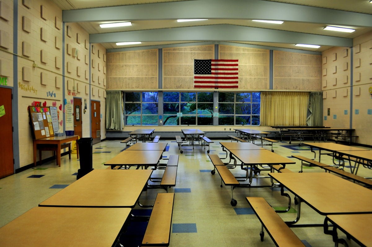A photo of a school cafeteria.