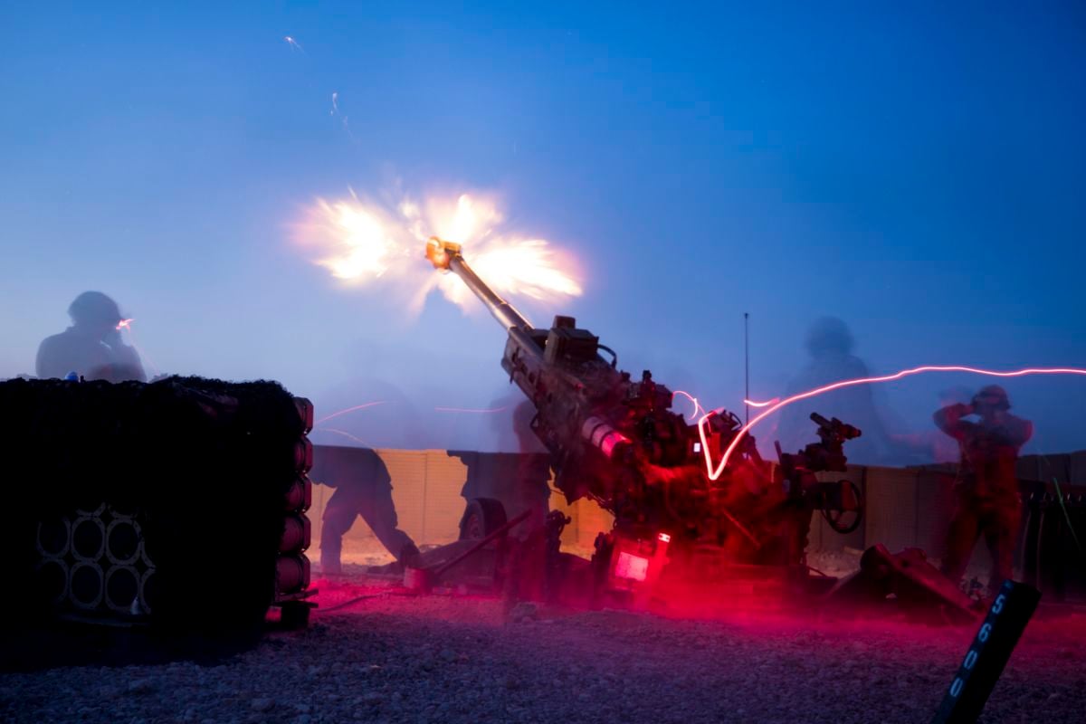 Soldiers fire an M777 howitzer during a fire mission at Qayyarah West Airfield, Iraq, August 10, 2019.